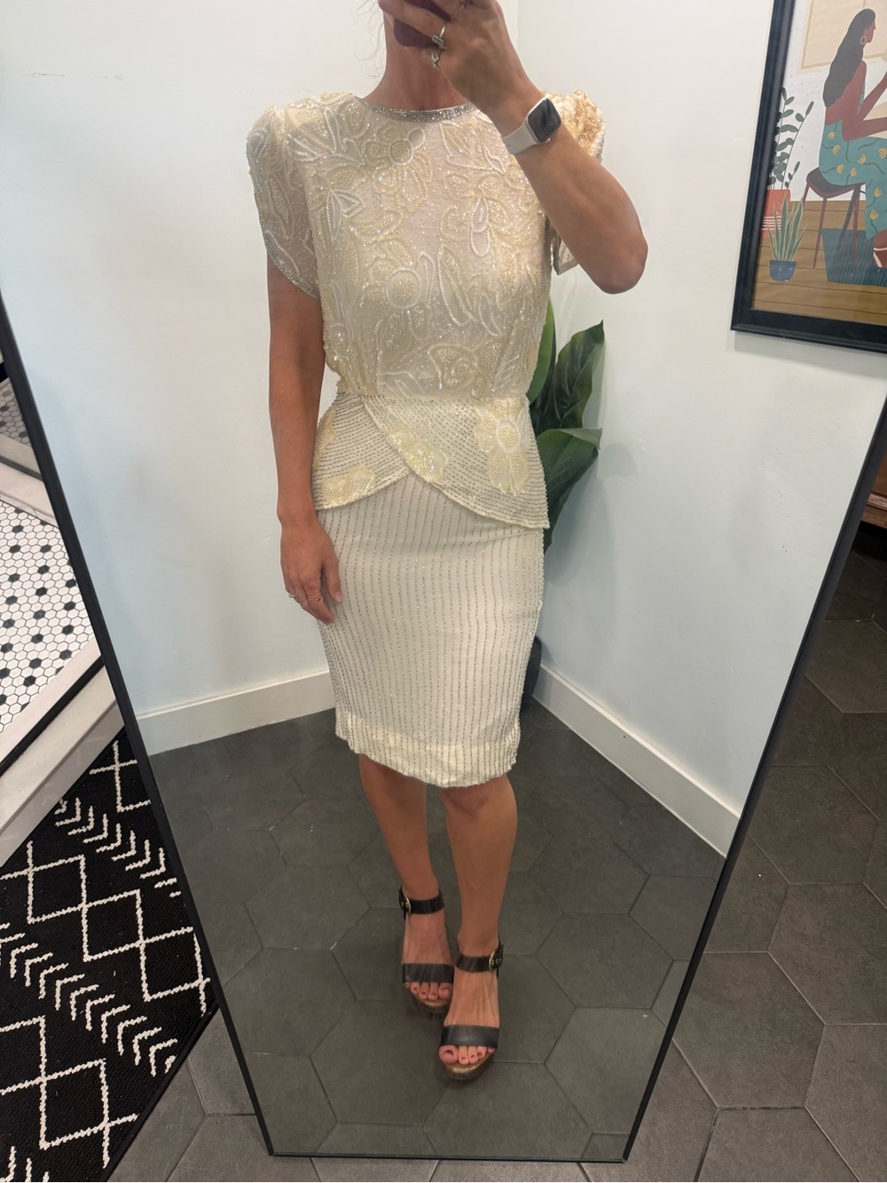 A vintage Oleg Cassini Cream Beaded Peplum Pencil dress